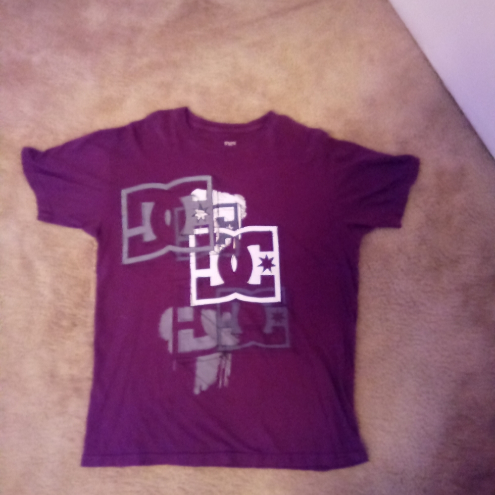 "DC" maroon,grey. And white. Large